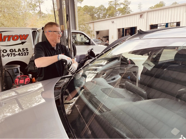 Pioneer Auto Glass Repair technician repairing a windshield